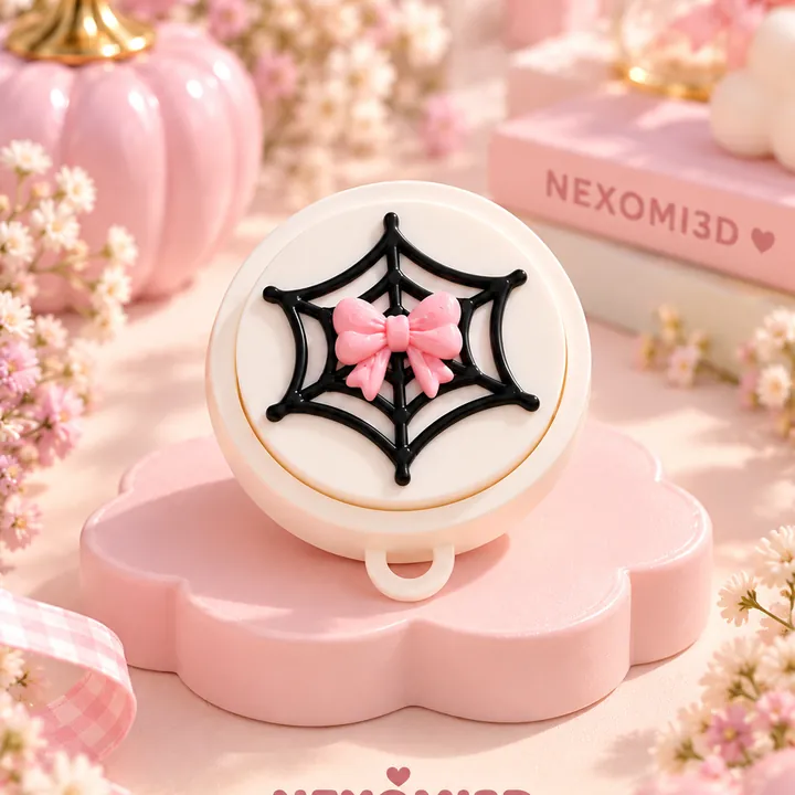 Clicker redondo de Halloween con una telaraña negra y un lazo rosa